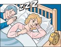 Woman with insomnia beside sleeping, snoring partner