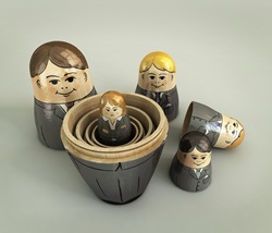 Frustrated businesswoman inside of open nesting dolls surrounded by smiling businessmen