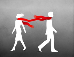 Man and women in scarf walking on windy day