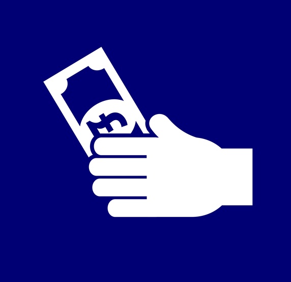 Hand holding British Pound banknote against blue background