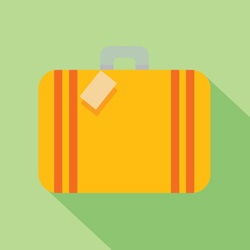 Yellow suitcase on green background