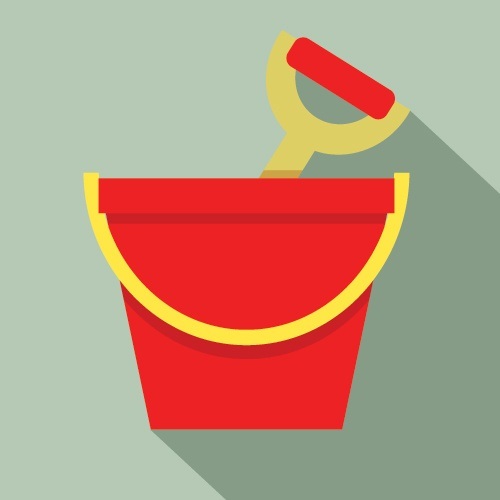 Red sand pail and shovel on colored background