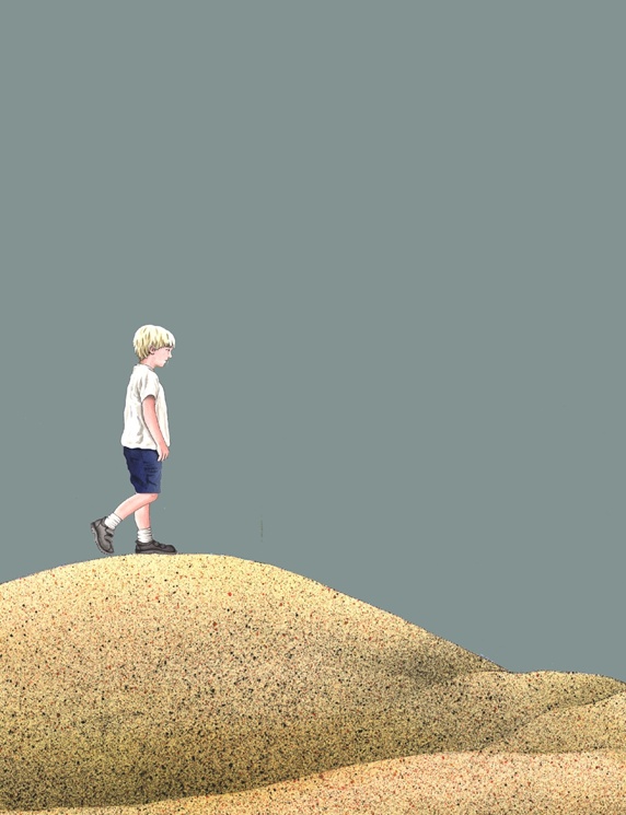 Boy walking through desert