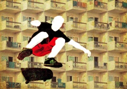 Skateboarder jumping against building facade