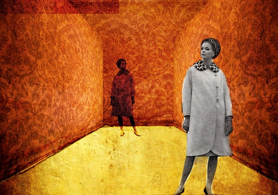 Woman in overcoat standing in room