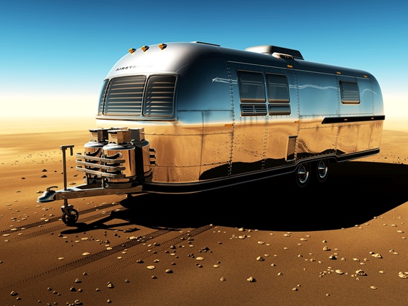 Metal trailer on desert, clear sky, digitally generated image