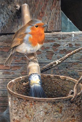 Robin perching on painting brush, weather wood in background
