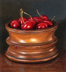 Cherries in wooden pot and red beetle
