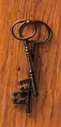 Old-fashioned keys hanging on nail
