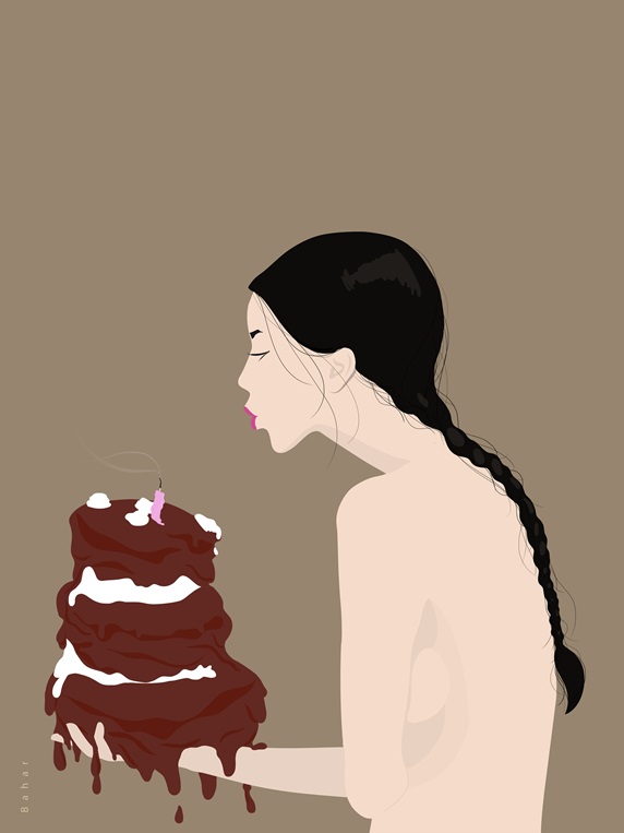 Woman blowing candles on cake
