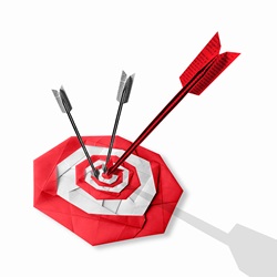 Folded paper arrows hitting target