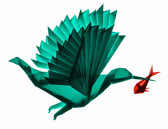 Origami bird flying with fish in beak