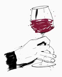Hand swirling glass of red wine