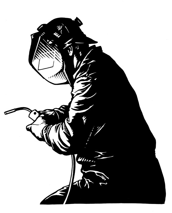 Welder wearing mask and holding welding torch
