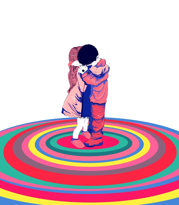 Boy and girl hugging on colorful rings