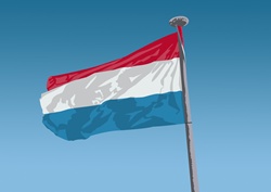 Dutch flag against blue sky