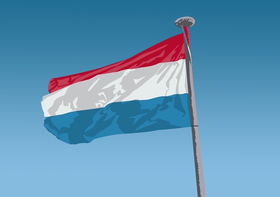 Dutch flag against blue sky