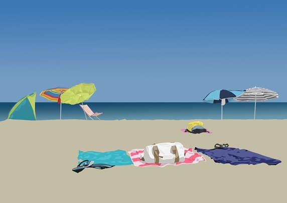 Sandy beach with towels and sunshades