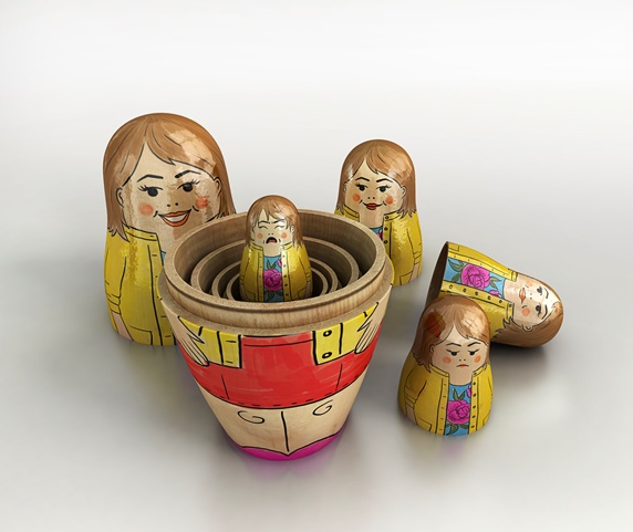 Small crying woman revealed inside of open nesting dolls in order of size and happiness