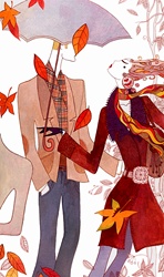 Stylish man and woman walking through falling autumn leaves in wind