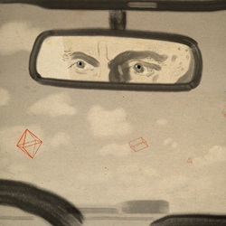 Man's eyes reflected in car rear view mirror