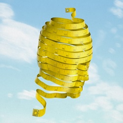 Face shaped yellow measure tape against sky