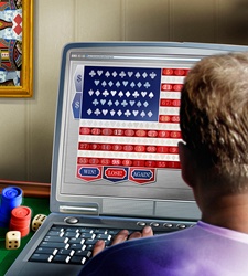 Man using laptop for online gambling