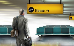 Businessman arriving in airport looking at home direction sign