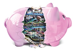Broken piggy bank revealing complex electronics