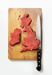 Meat in shape of United Kingdom on cutting board