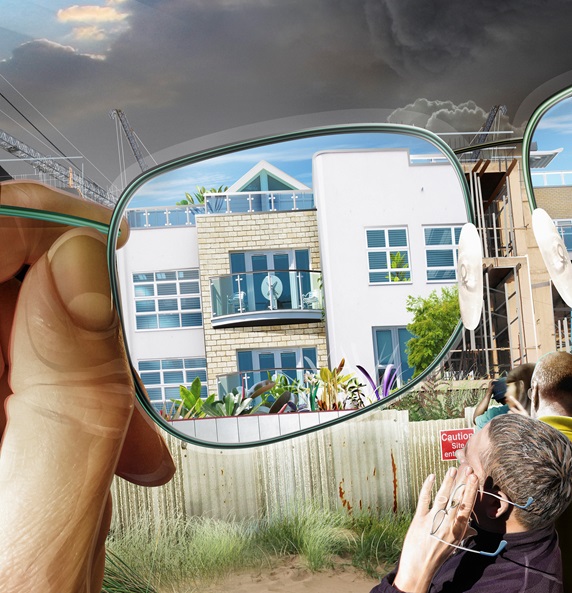 Man looking through glasses and imagining new building on construction site