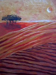 Landscape with plowed fields and trees at sunset