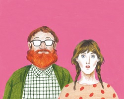 Portrait of geeky couple looking at camera