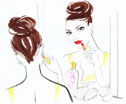 Beautiful woman applying red lipstick in mirror