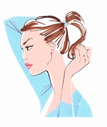 Close up of beautiful woman putting hair in ponytail