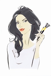Beautiful woman looking at camera holding makeup brushes