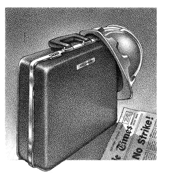 Briefcase, hard helmet and newspaper
