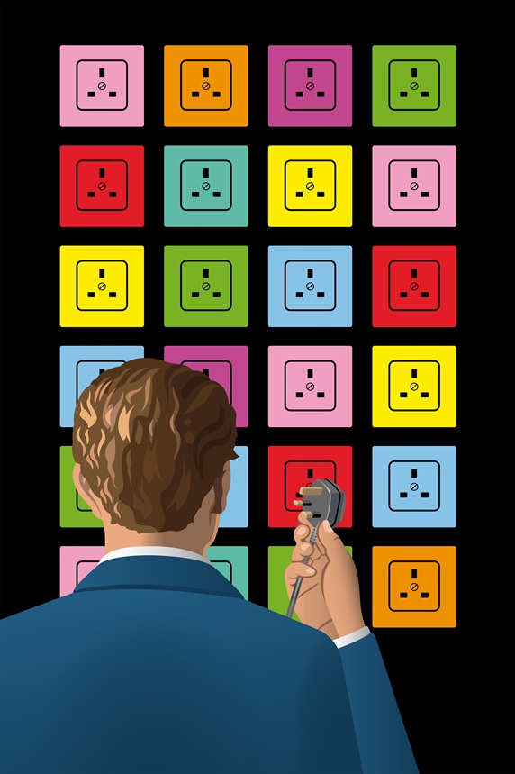 Man with electric plug in front of multicolored outlets