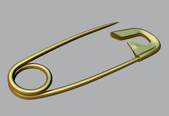 Gold metal safety pin, grey background