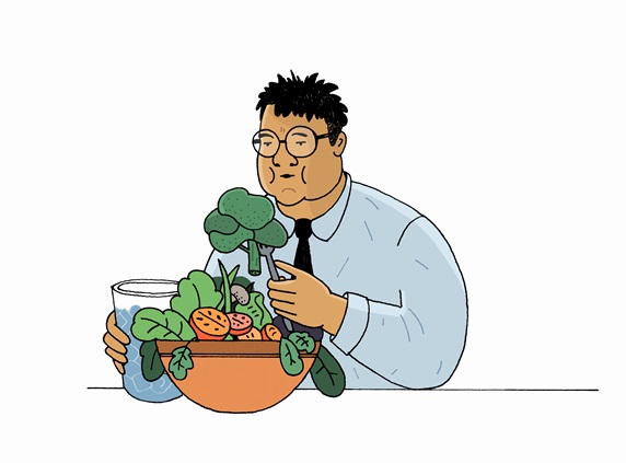 Overweight man eating large bowl of vegetables