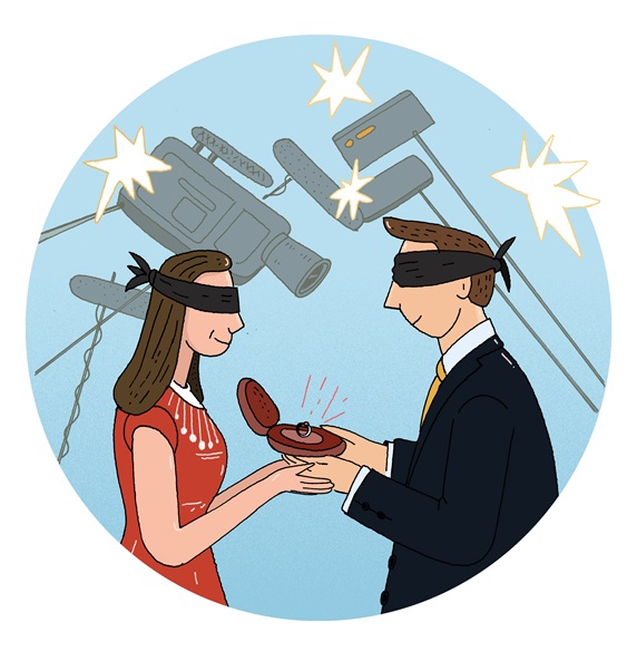Blindfolded couple holding engagement ring surrounded with movie cameras