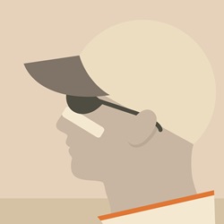 Profile of man wearing baseball cap and sunglasses