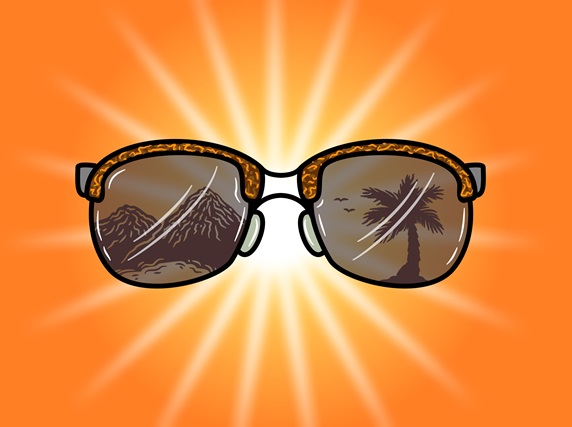 Sunglasses reflecting mountains and palm trees