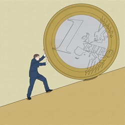Man pushing one euro coin up hill
