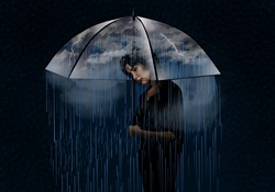 Woman under umbrella with rain and lightning storm