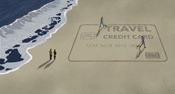 Men raking to scratch out image of travel credit card on beach at ocean
