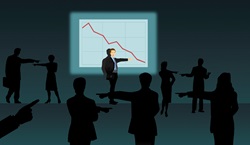 Business people pointing the finger of blame for bad performance