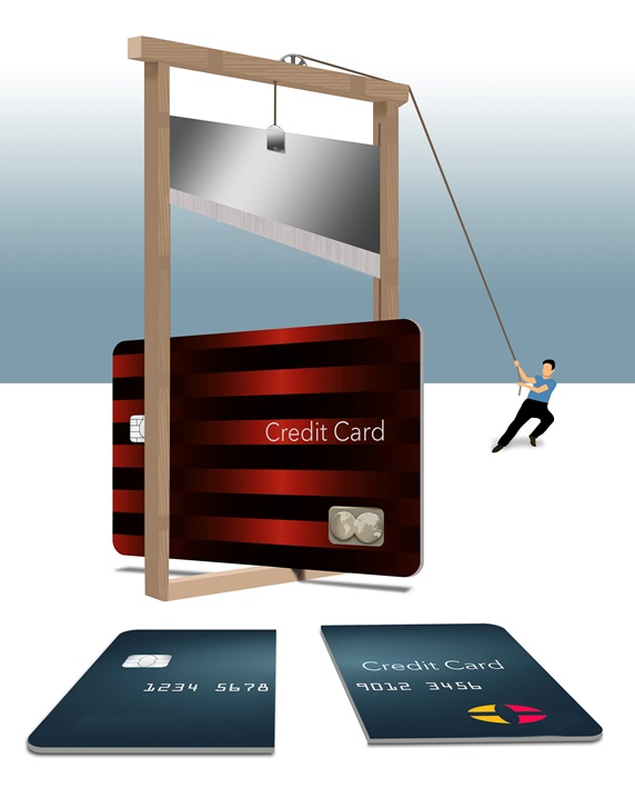 Man cutting credit card with guillotine