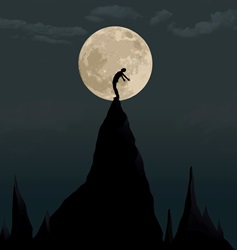 Silhouette of person on top of mountain against moon ay night