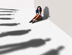 Woman surrounded by ominous shadows